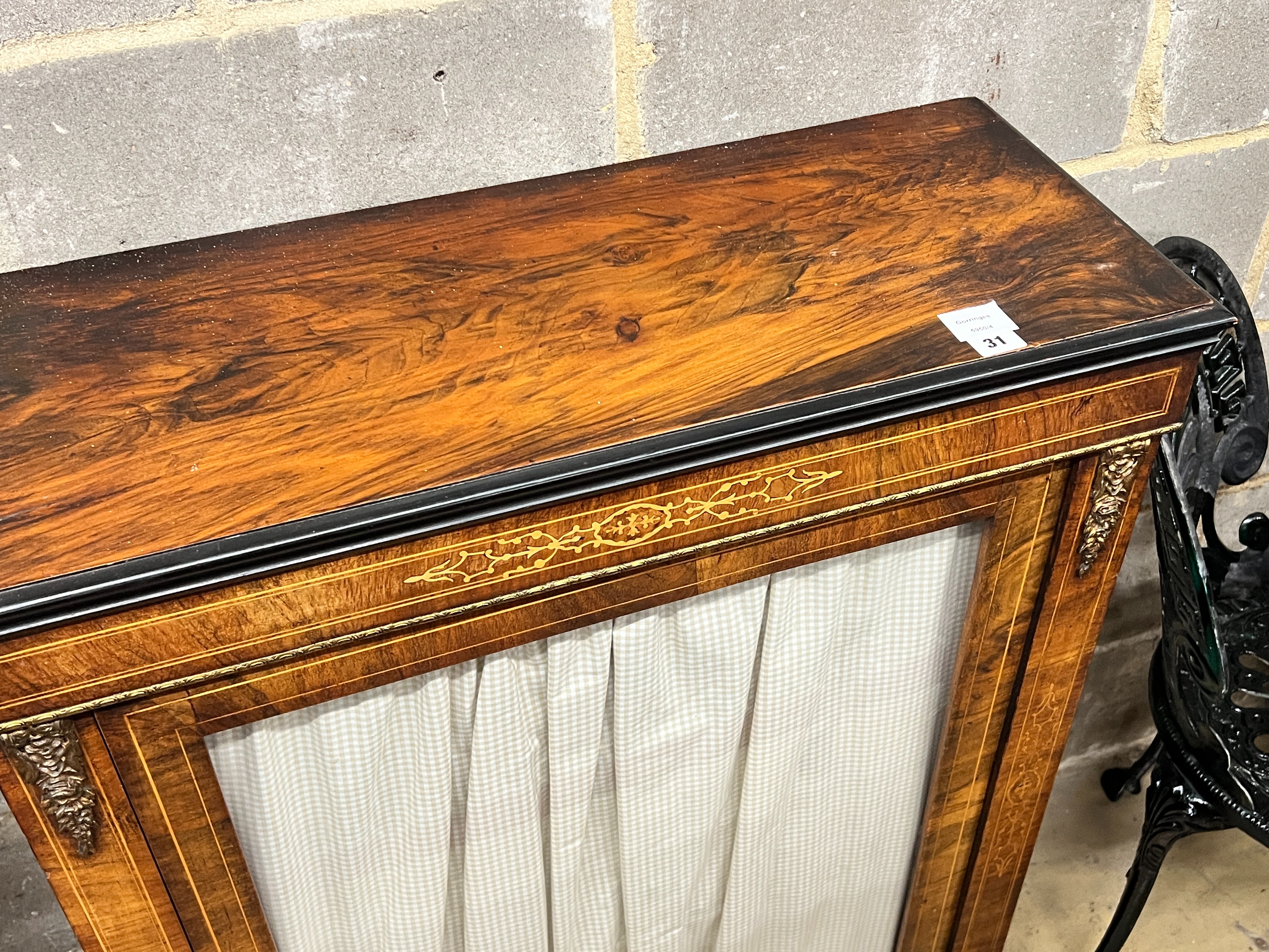 A Victorian gilt metal mounted inlaid walnut pier cabinet, with a single glazed door, width 80cm, depth 32cm, height 99cm
